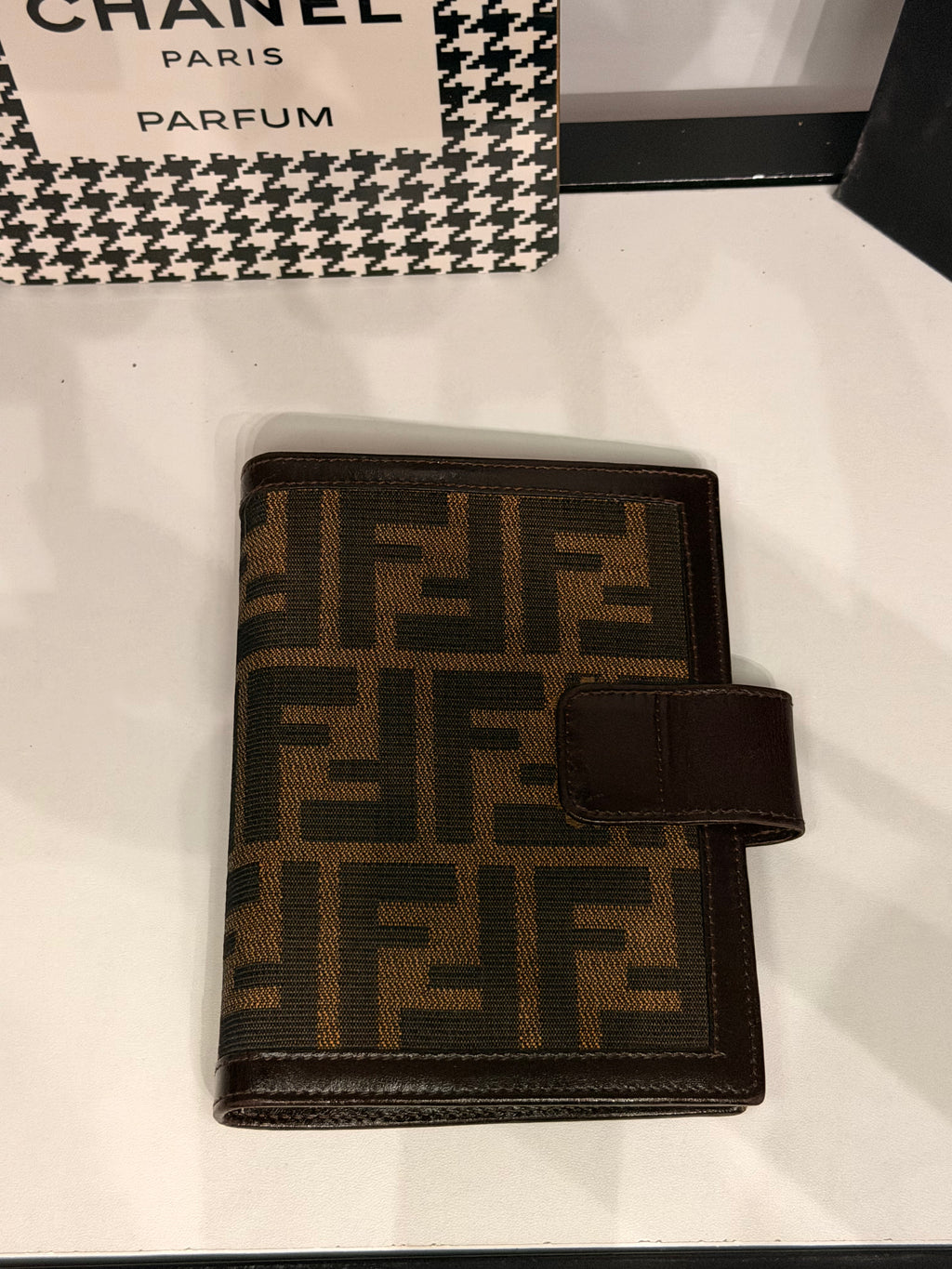 vintage Fendi agenda cover featuring the iconic brown and black Zucca FF monogram canvas with dark brown leather trim.