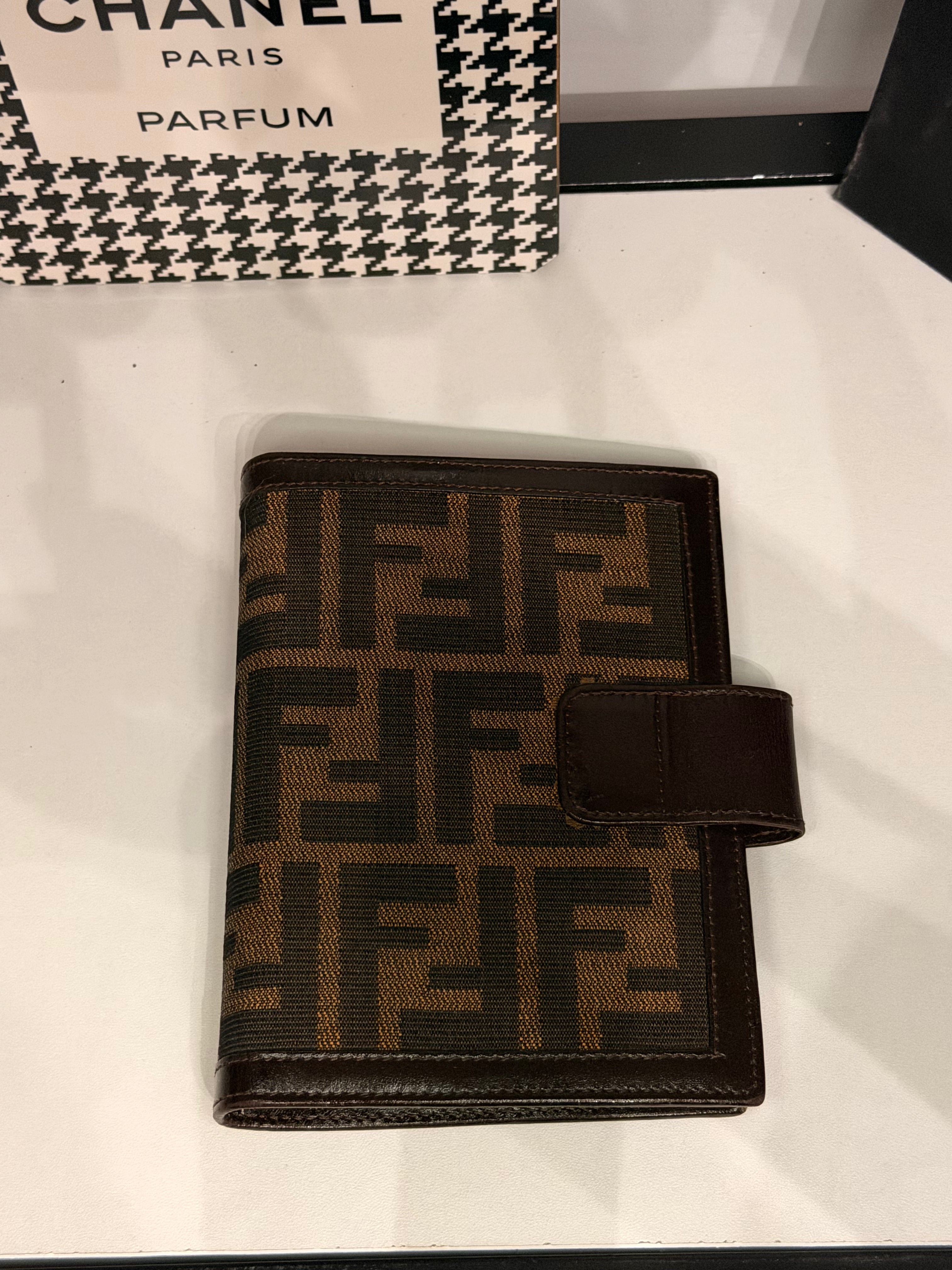 vintage Fendi agenda cover featuring the iconic brown and black Zucca FF monogram canvas with dark brown leather trim.