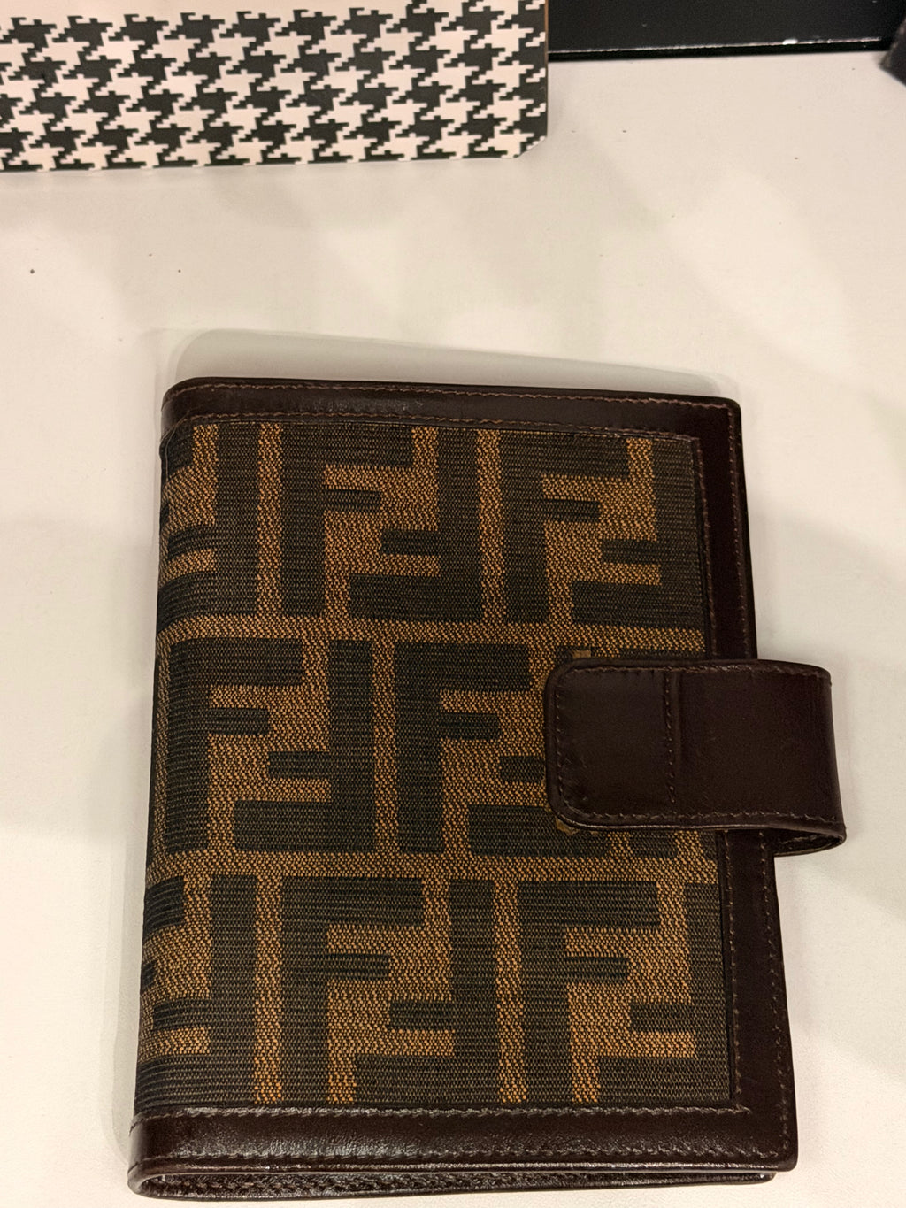 vintage Fendi agenda cover featuring the iconic brown and black Zucca FF monogram canvas with dark brown leather trim.
