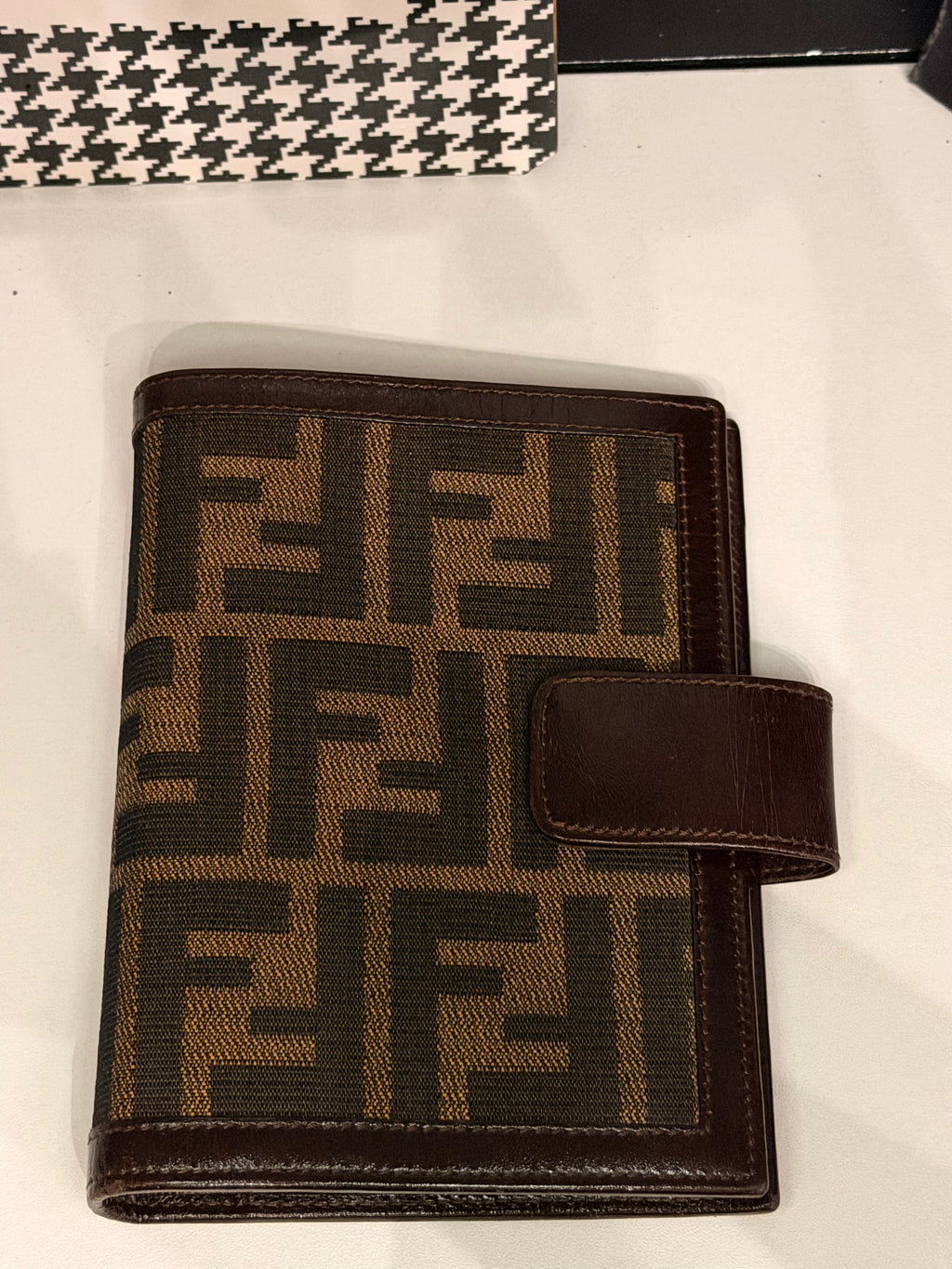 vintage Fendi agenda cover featuring the iconic brown and black Zucca FF monogram canvas with dark brown leather trim.