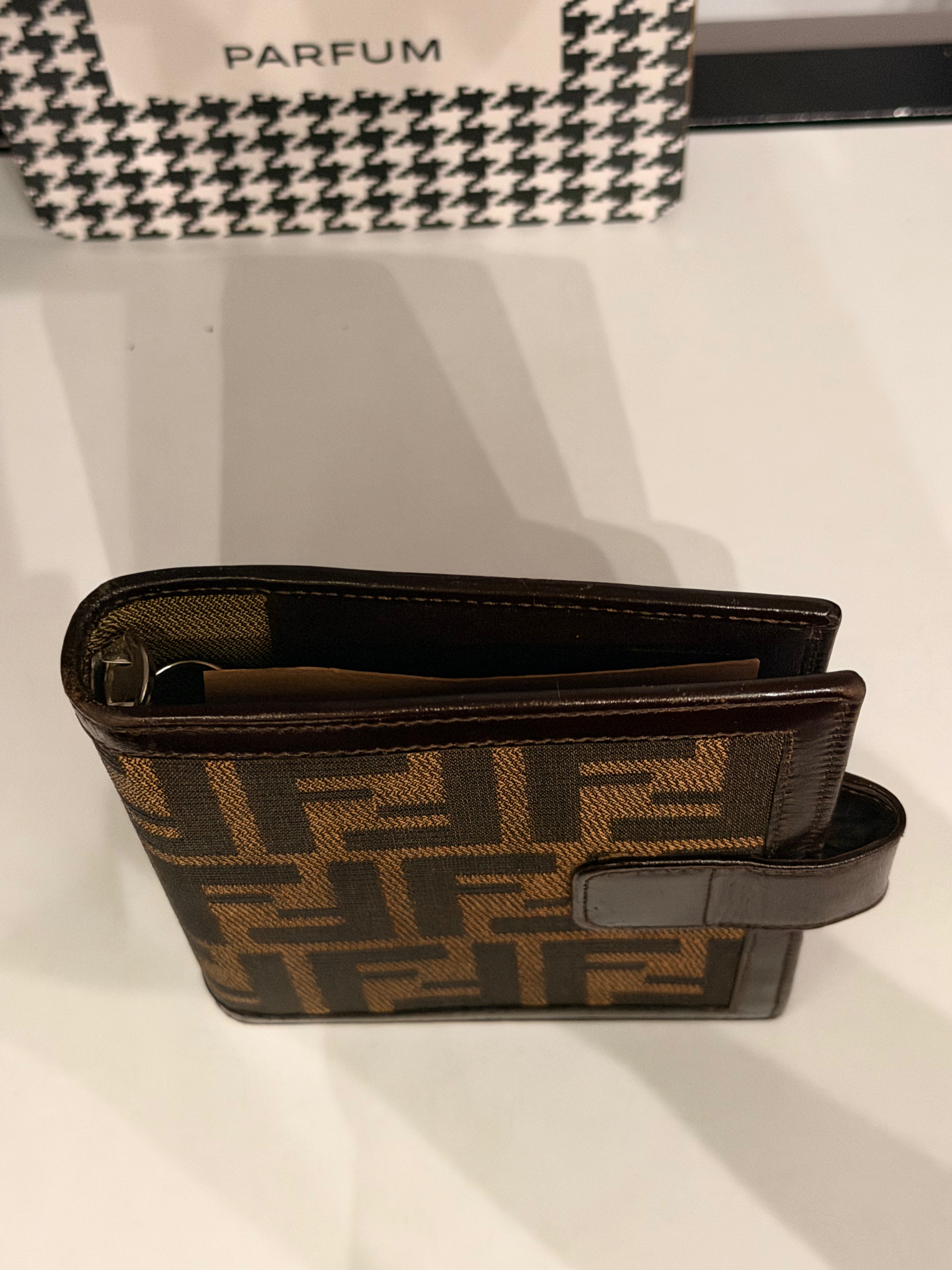 vintage Fendi agenda cover featuring the iconic brown and black Zucca FF monogram canvas with dark brown leather trim.