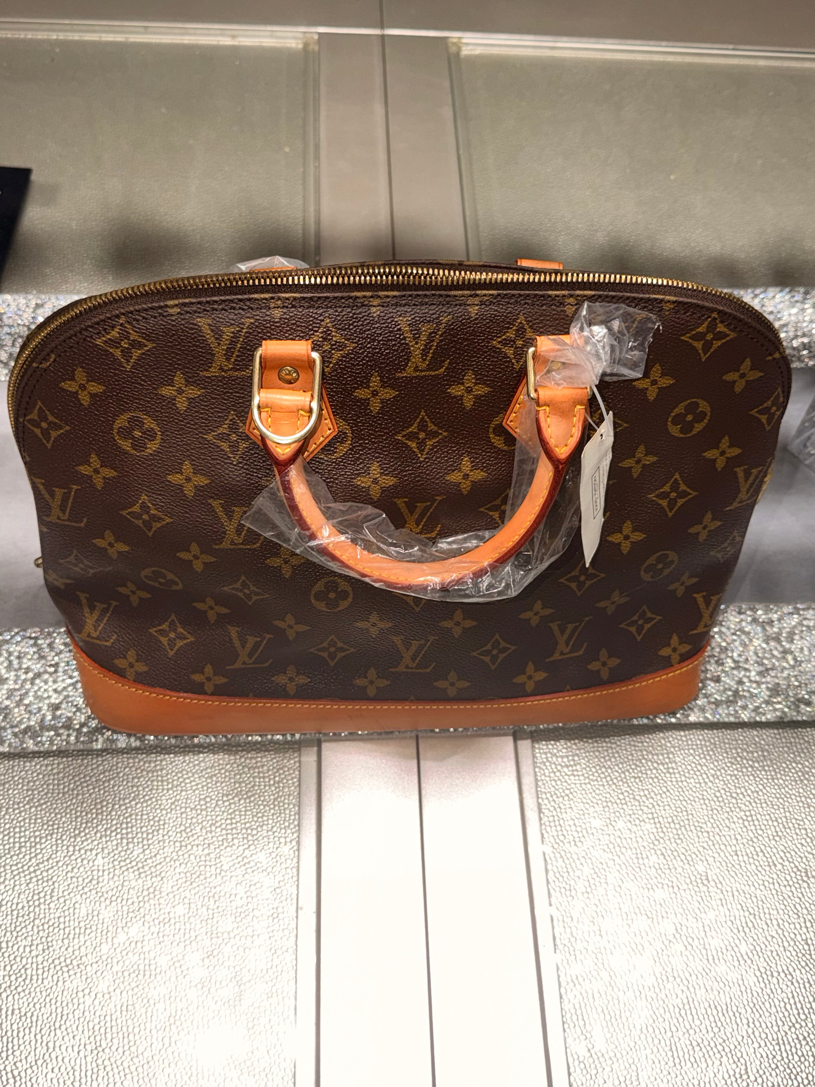 Louis Vuitton Alma PM Monogram Canvas Handbag