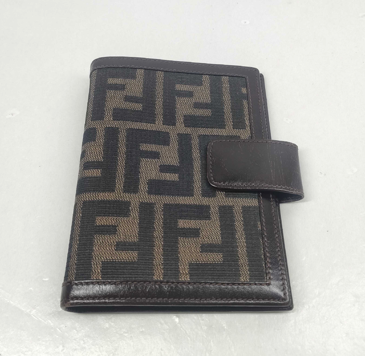 vintage Fendi agenda cover featuring the iconic brown and black Zucca FF monogram canvas with dark brown leather trim.