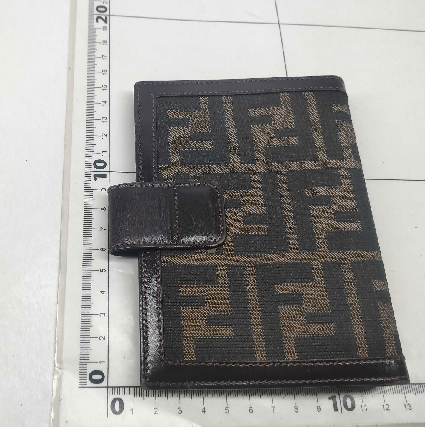 vintage Fendi agenda cover featuring the iconic brown and black Zucca FF monogram canvas with dark brown leather trim.