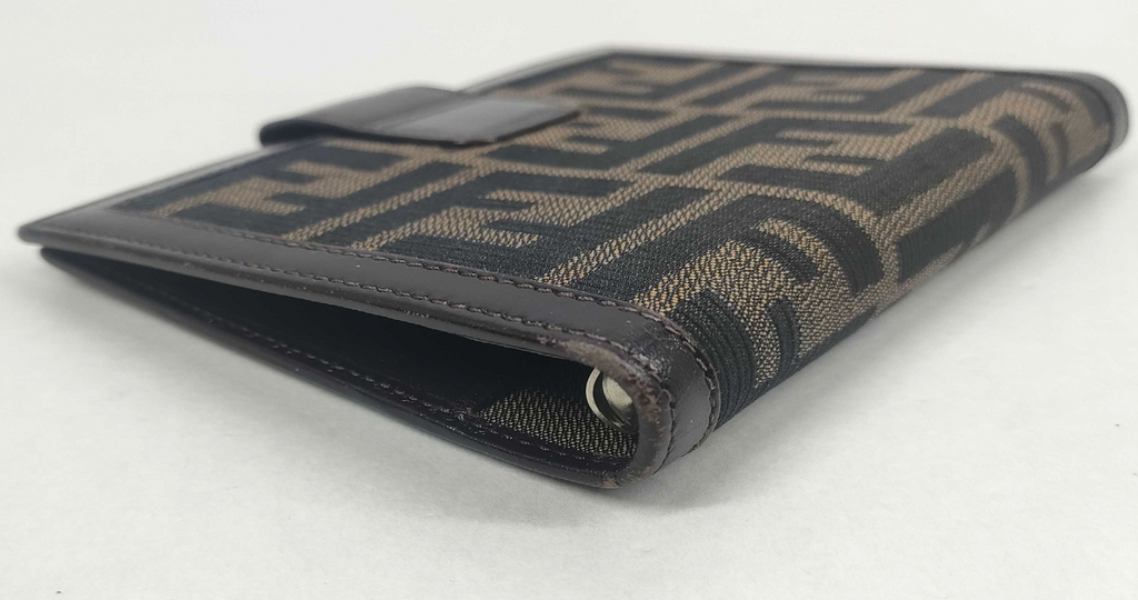 vintage Fendi agenda cover featuring the iconic brown and black Zucca FF monogram canvas with dark brown leather trim.