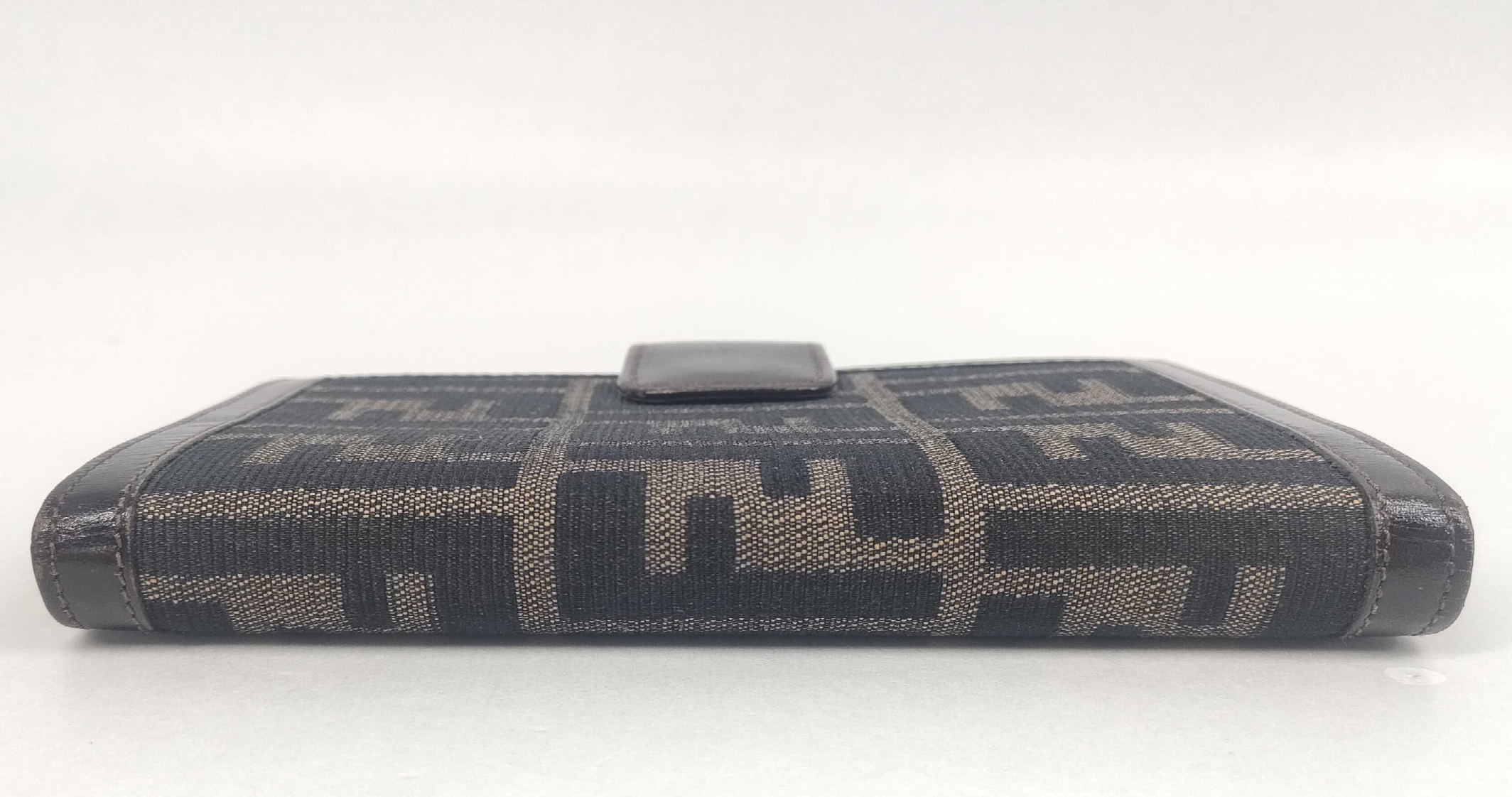 vintage Fendi agenda cover featuring the iconic brown and black Zucca FF monogram canvas with dark brown leather trim.