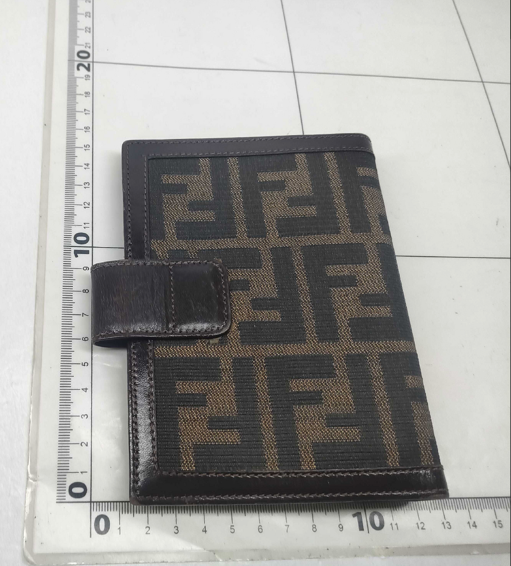 vintage Fendi agenda cover featuring the iconic brown and black Zucca FF monogram canvas with dark brown leather trim.