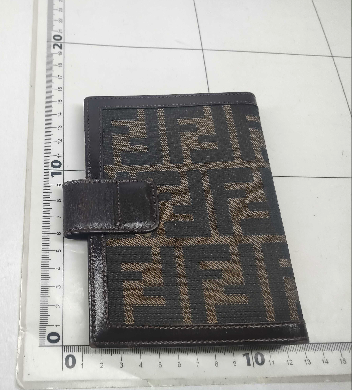 vintage Fendi agenda cover featuring the iconic brown and black Zucca FF monogram canvas with dark brown leather trim.