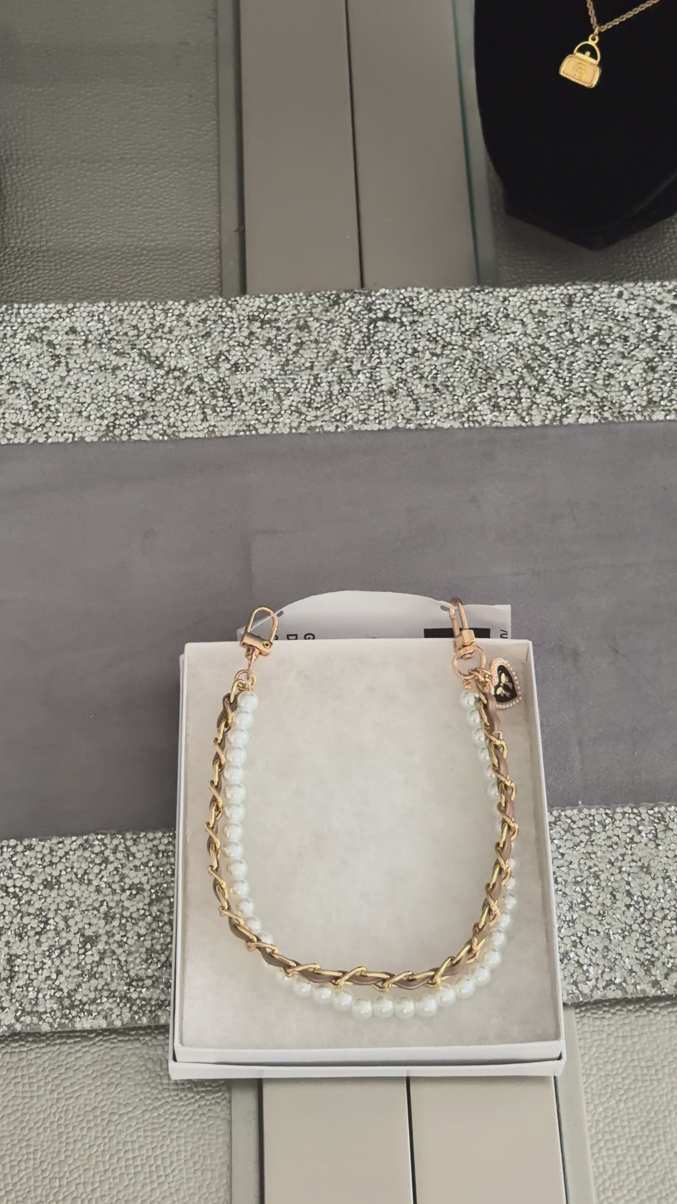 Golden Darling Strap" by Charmed Dollhouse features a mixed-media design combining a warm gold chain with a strand of lustrous pearls.